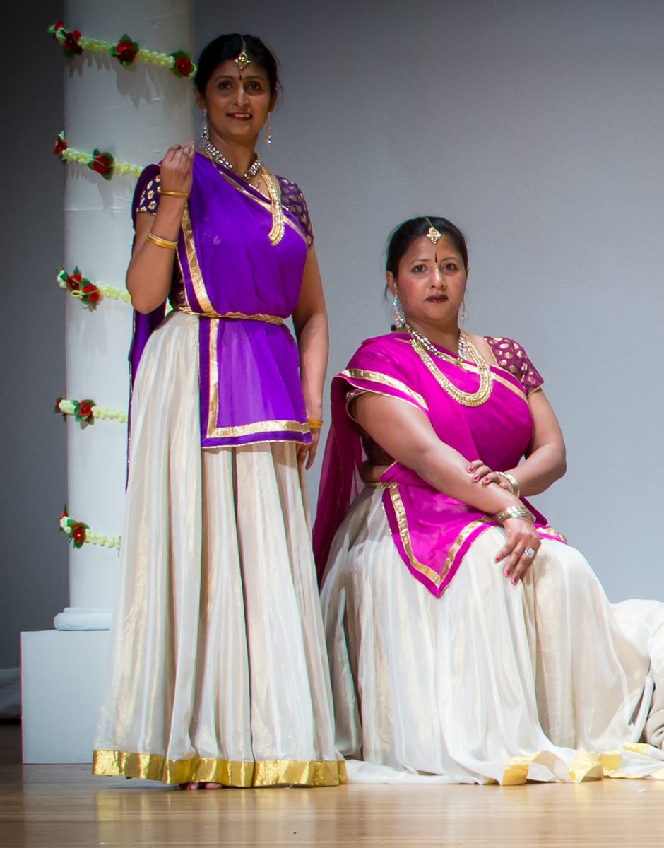 Aarti Gupta and Sapna Adhikari on stage in purple and white classical Kathak attire